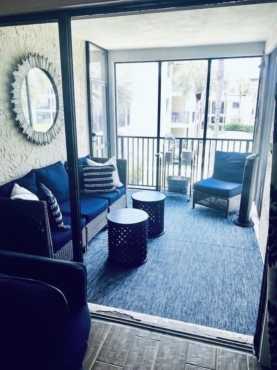 SCREENED BALCONY OVERLOOKING OCEANFRONT COURTYARD