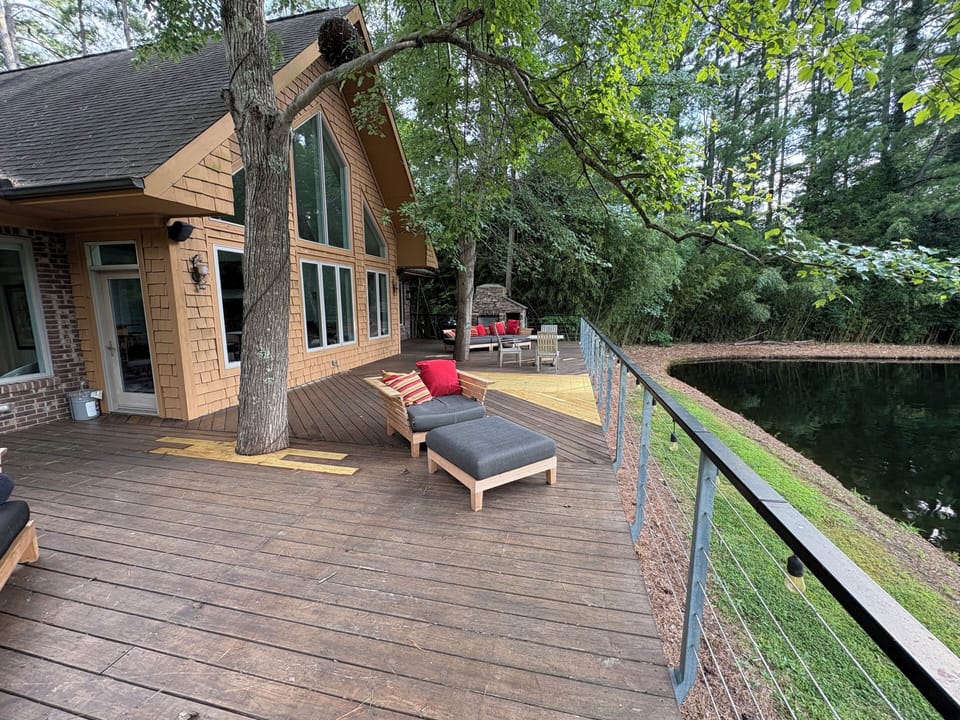 Waterside deck with fireplace.