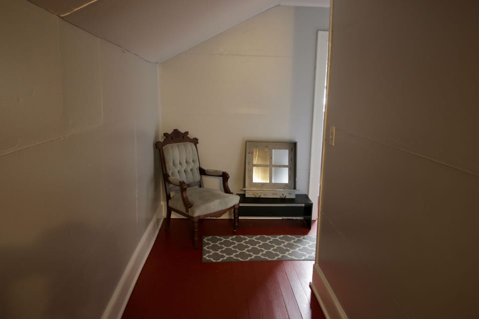 Upstairs hallway that leads to apartment entrance.  1 of 2 apartments.