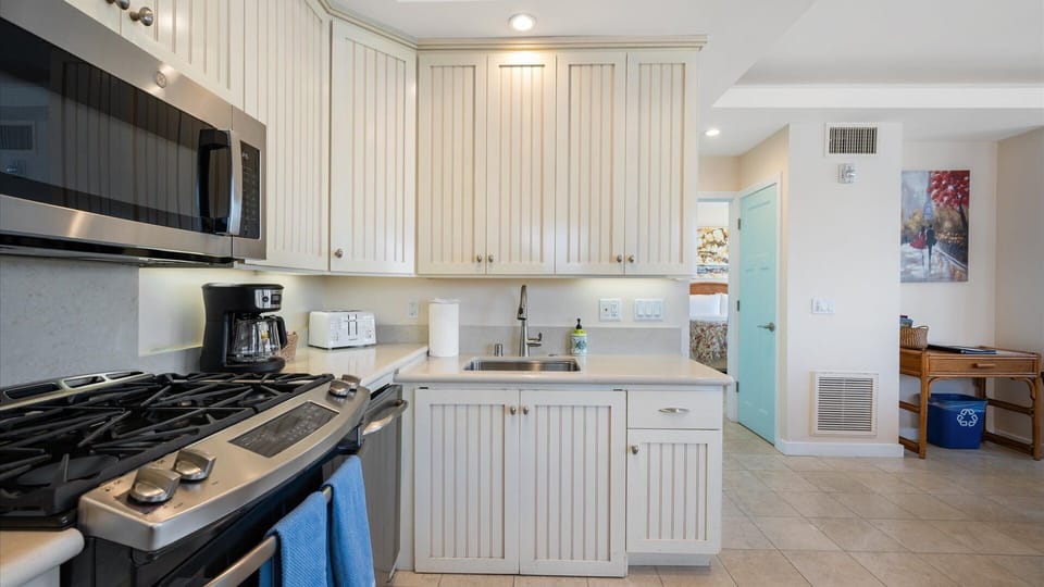 The kitchen has full size appliances and opens to living room, so you still get to enjoy the great views.