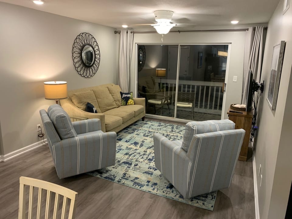 Living Room, exits to Balcony with stairway down to pool