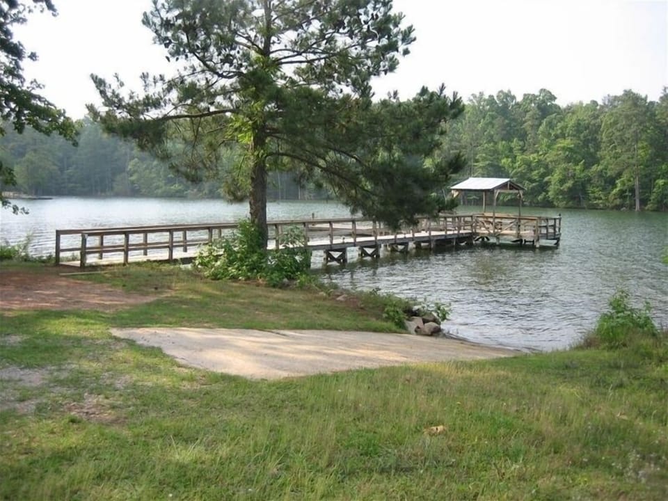 View of the dock and boat ramp. Pleanty of space to park cars and boats.