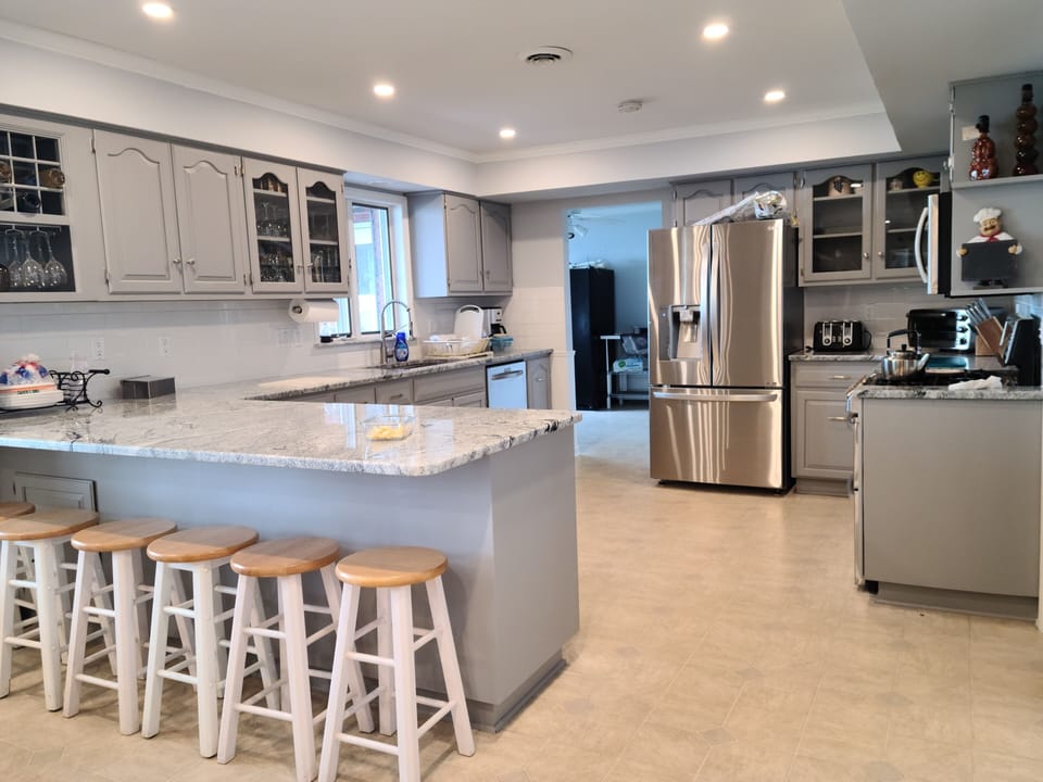 Kitchen, equipped with stainless steel appliances and 2 refrigerators