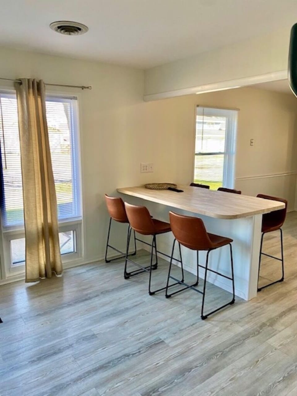 Large dining table and bar seating for fun family meals.