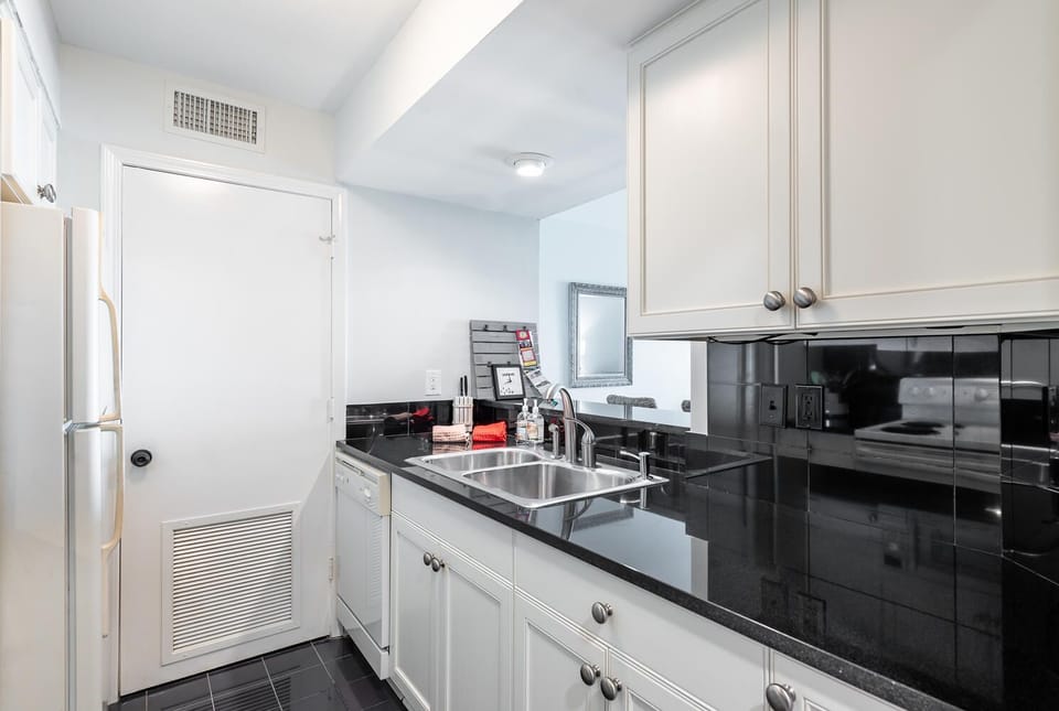 Kitchen looks out on the family room and the outside view.
