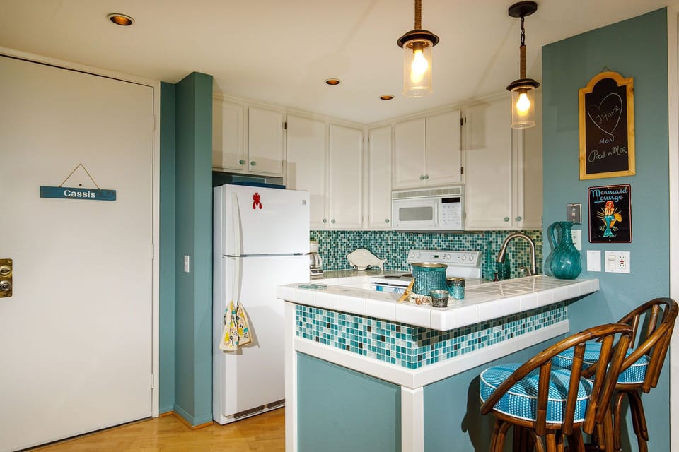 A new bar (2 bar stools) helps with the flow during cocktail hour!