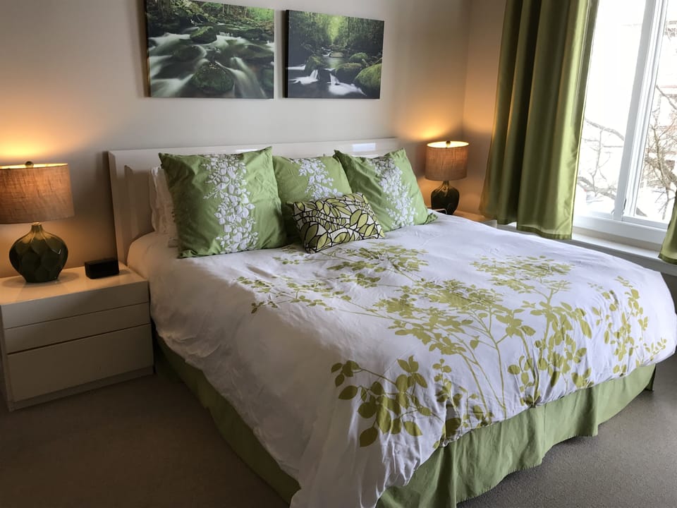 The master bedroom has a king-sized bed, and wonderful mountain views.