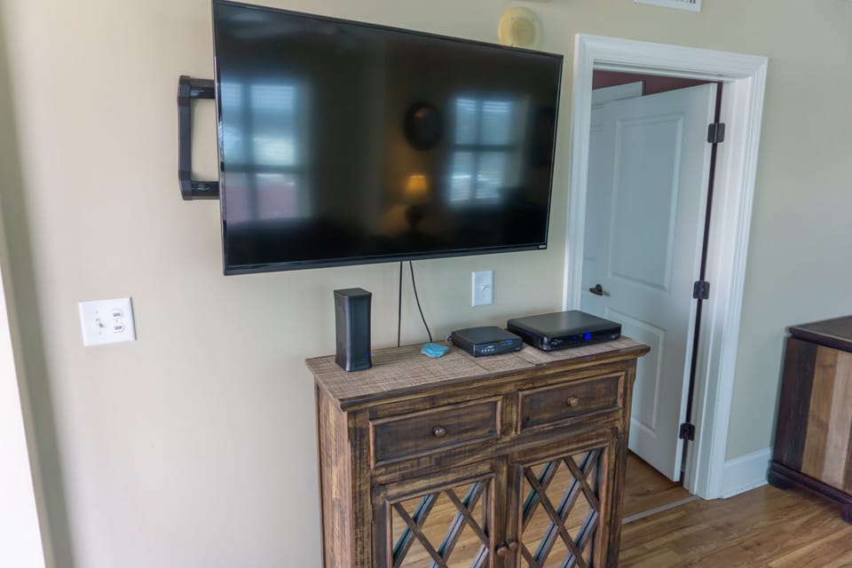 large new tv in living room  also can tape shows,  netflix access