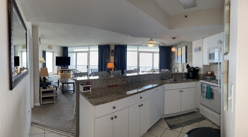 VIEW INTO LIVING & DINING ROOM FROM HALL/KITCHEN ENTRY.