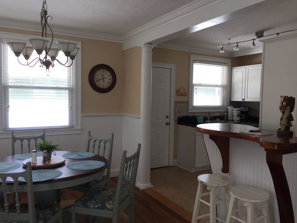 Enjoy your meals at the dining table, or for a quick bite, the custom bar works.