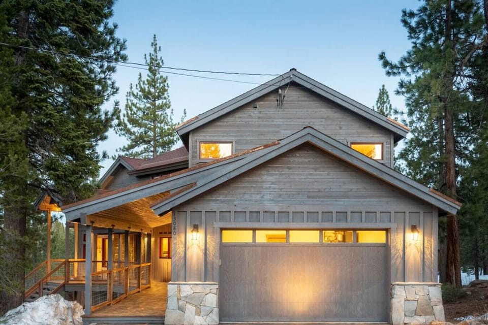 Large 2 car garage with EV charger, long covered porch entry way.