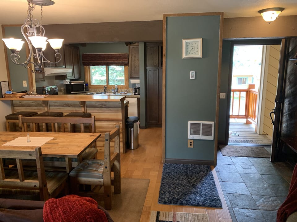 Slate tiled Entryway leads into dining and living area. 