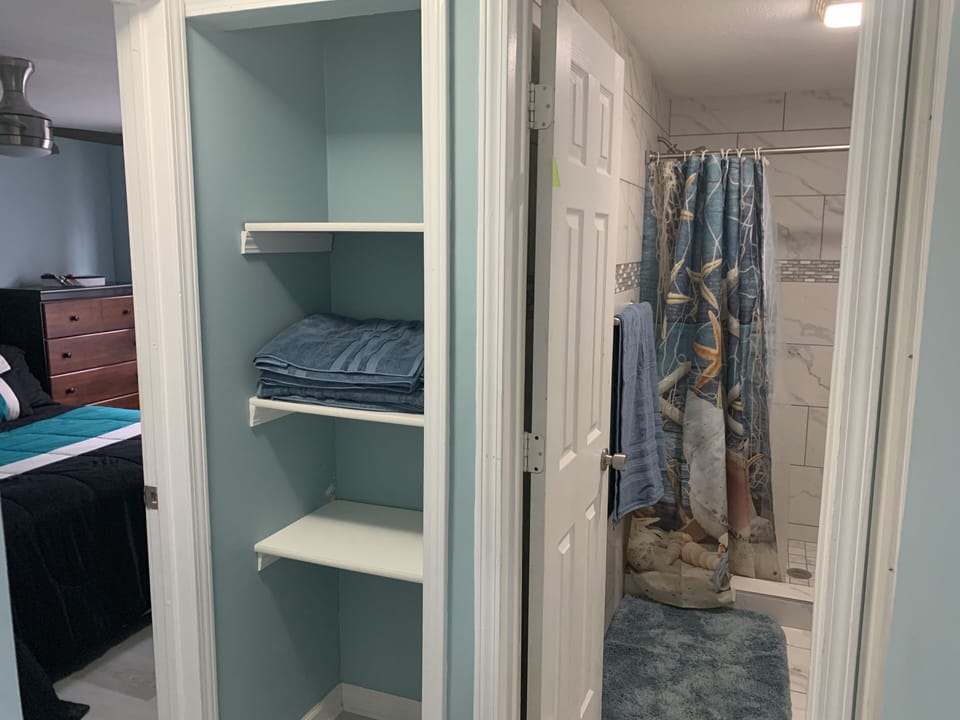 Linen and Towel storage rack next to the bathroom and the 2nd bedroom.
