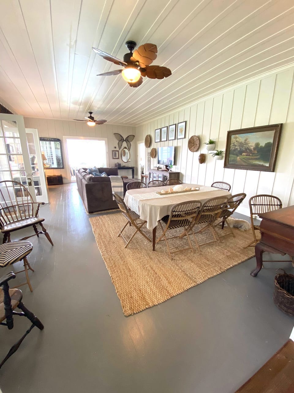 Living room/dining area.Table has a leaf to seat 10-12