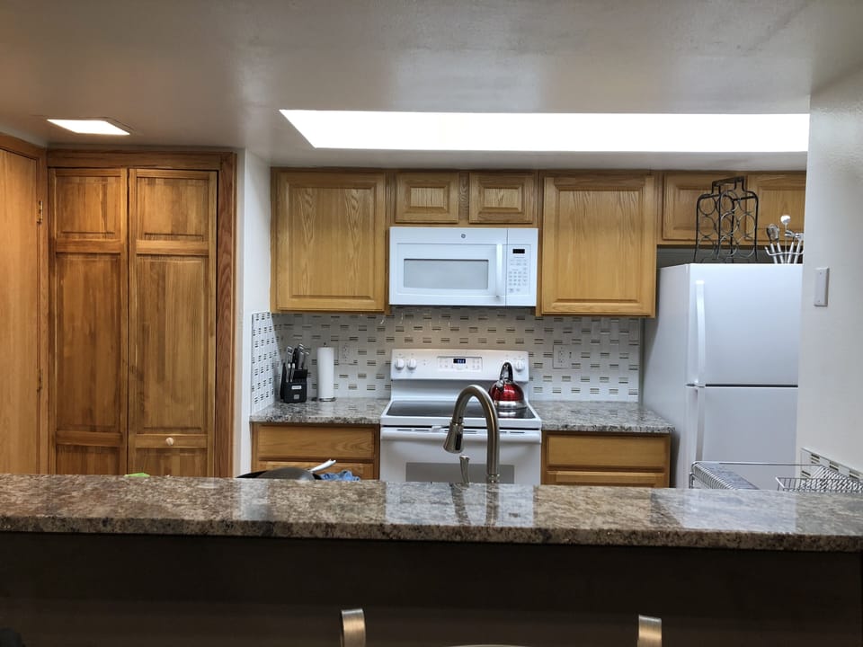 Kitchen view from dining room. New granite counter, appliances and much more....