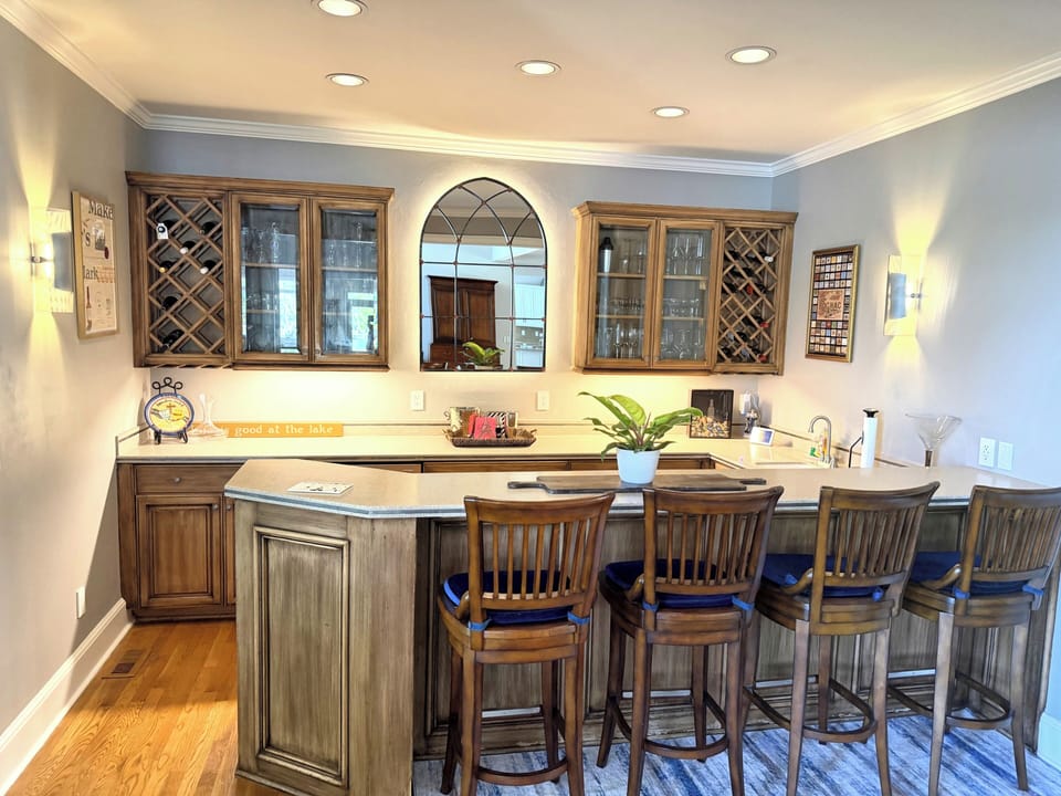 Bar Area off the great room includes a small refrigerator, ice maker, and sink. 