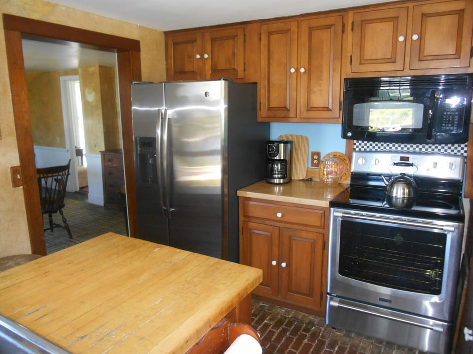 Kitchen with adjacent dining deck is fully updated