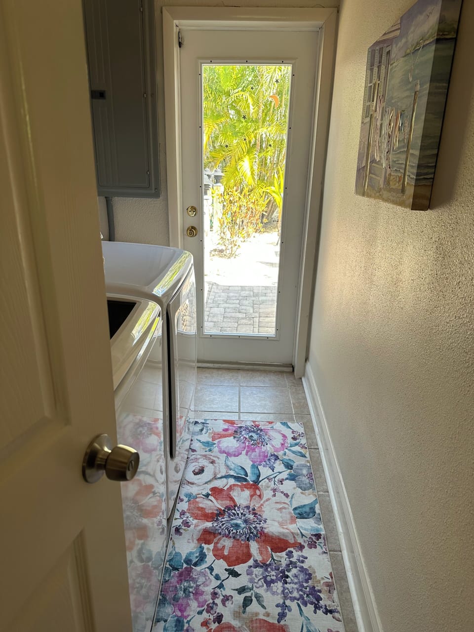Indoor laundry room with new washer and dryer