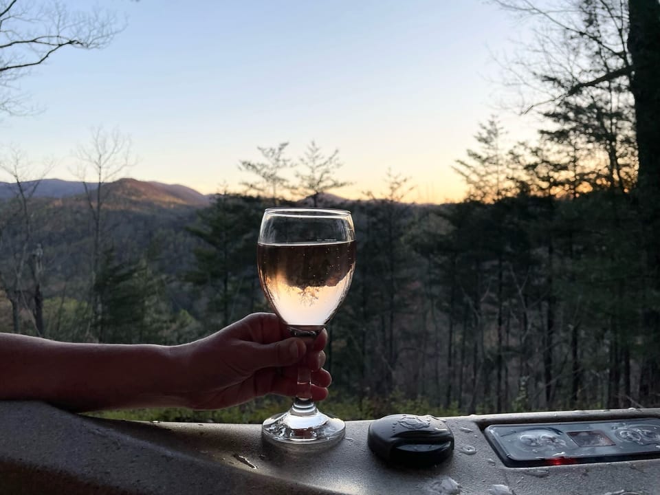 A little liquid refreshment while relaxing in the hot tub after a busy day.