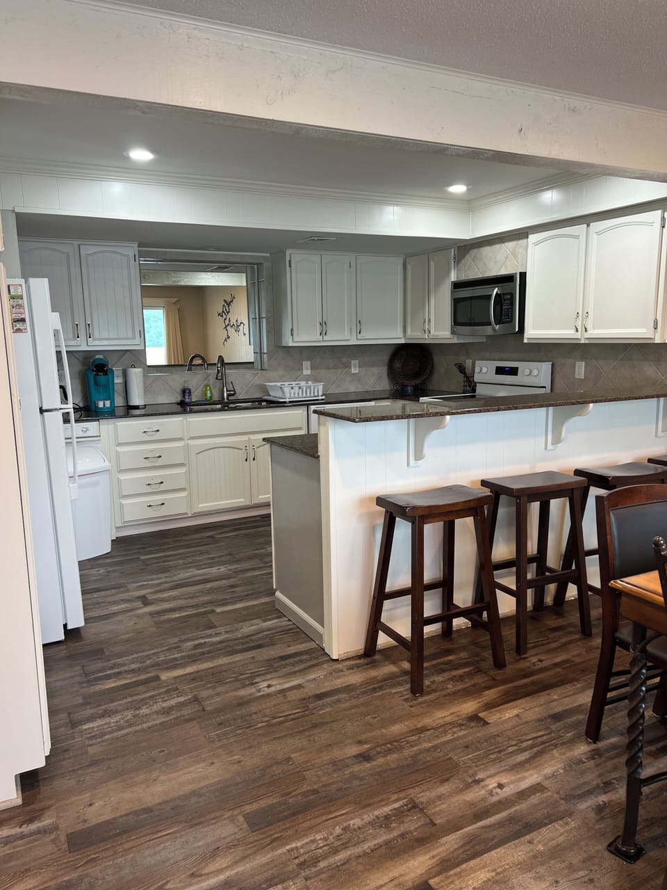 Full stocked kitchen on the lower level, with new appliances and right off patio
