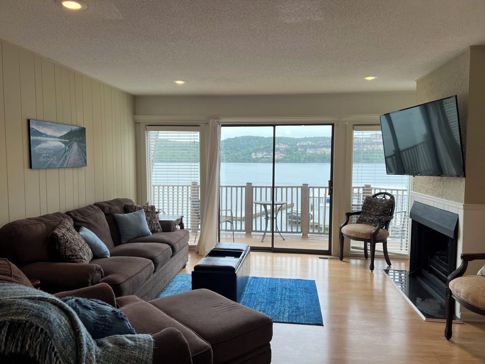 Main Level Living Room with Large TV, VIEWS, and a deck to enjoy the views!