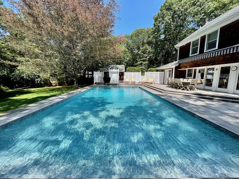 Large 40x20 ft heated salt-water pool with stadium stairs perfect for group pix