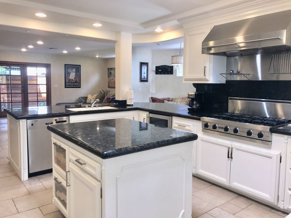 Kitchen, looking towards the Family Room  & back patio.