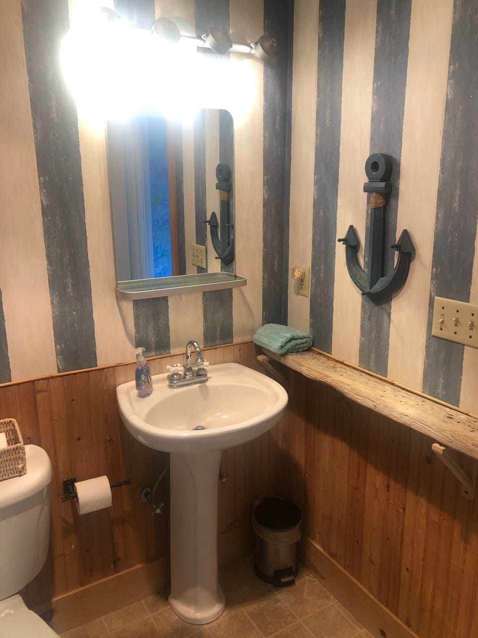 The bathroom is clean and beachy!