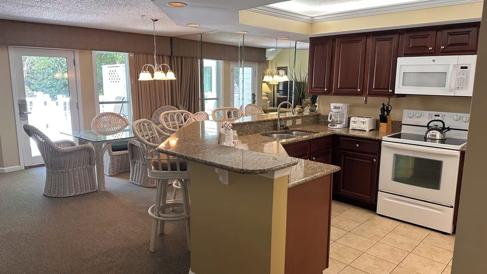 Open concept kitchen. Granite counters, D/W, ElecRange/Oven, French Dr Fridge.