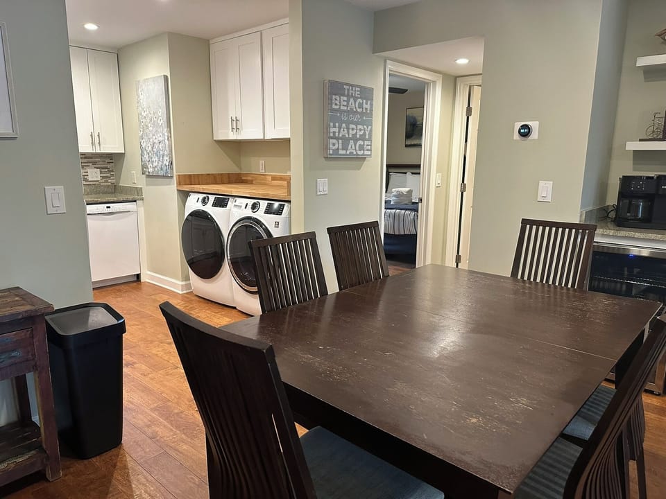 Dining for six, new full-size front-load washer and dryer.