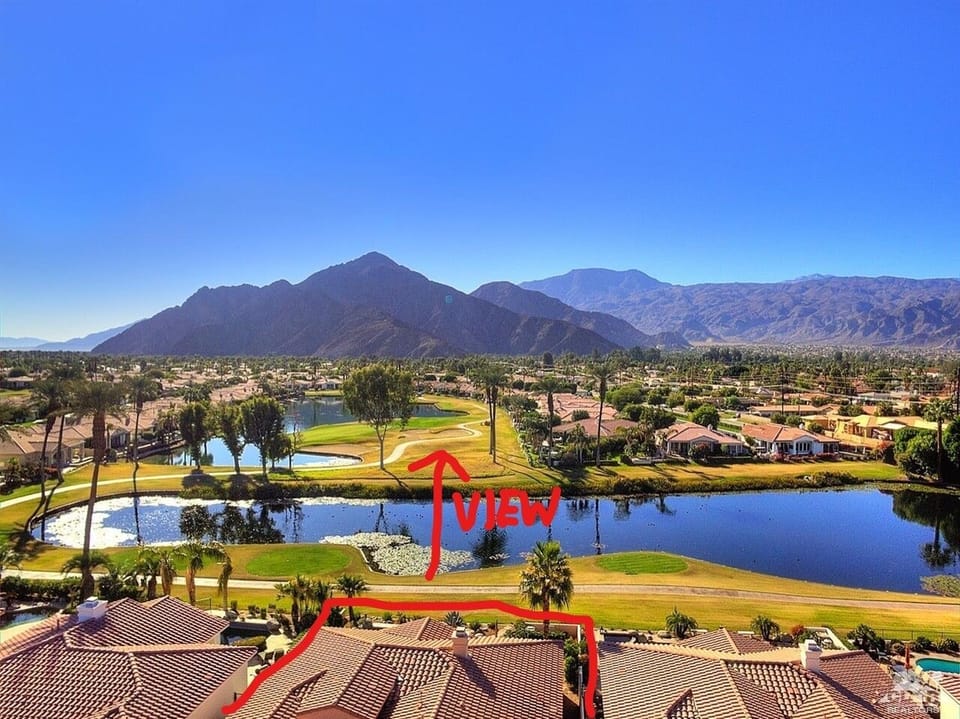 Drone shot showing  unobstructed South Facing views of the course from our home 