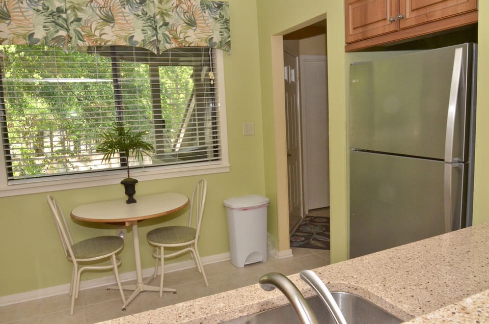 Our spacious kitchen has a beautiful view of the trees.