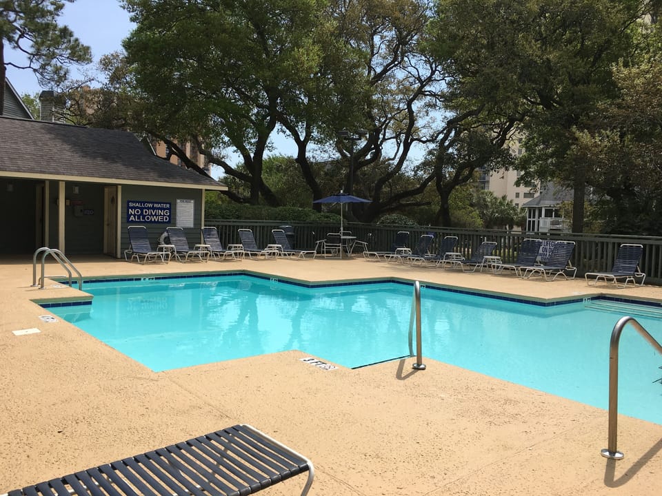 The private St. James Park pool has lovely tree shaded areas.