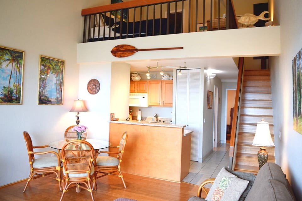 Bright and open living area with second bedroom in loft.