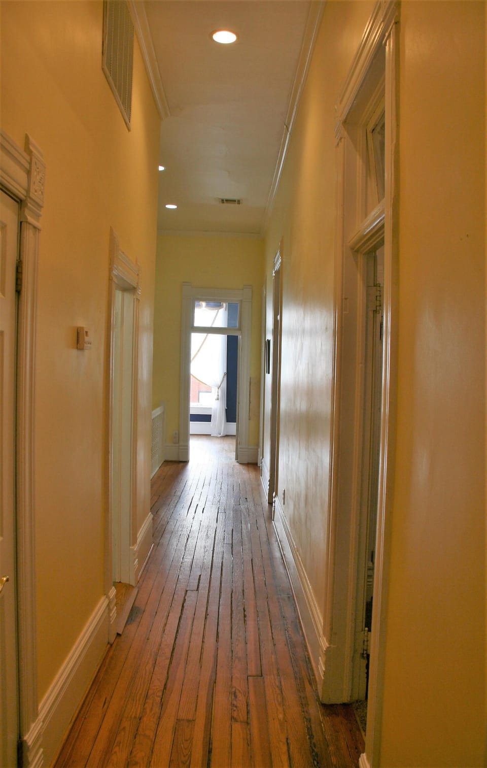 Hallway to bedrooms, kitchen, laundry, dining room and den