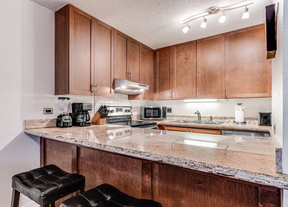 Kitchen with bar stools.