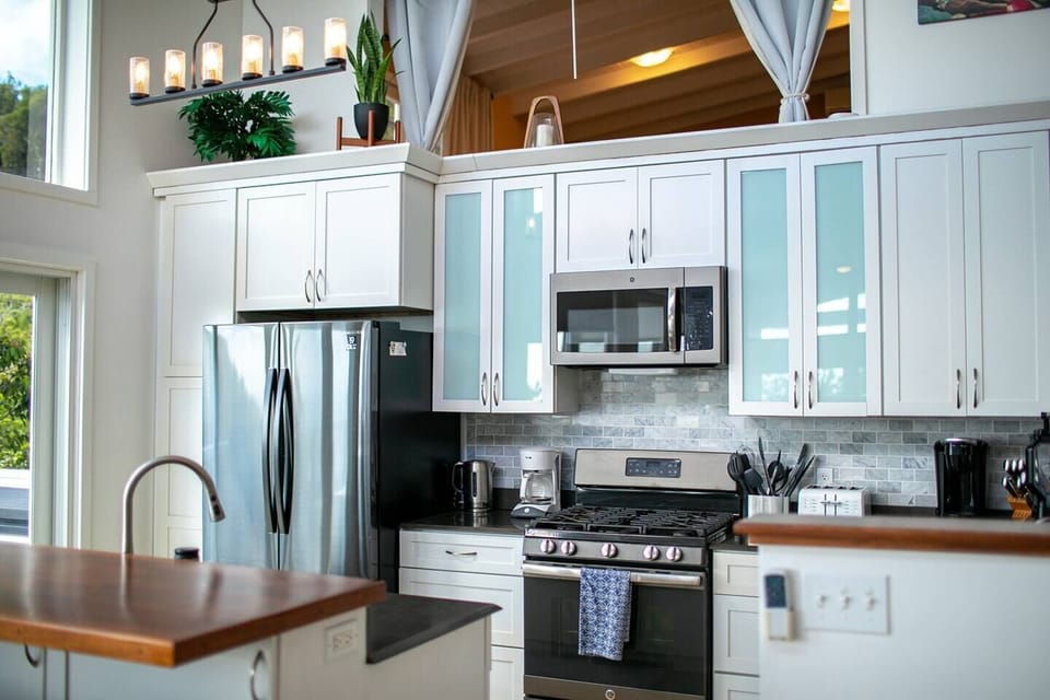 Kitchen equipment includes french door refrigerator, gas oven and stovetop, microwave, dishwasher, toaster, electric tea kettle, Keurig coffee machine and drip coffee machine