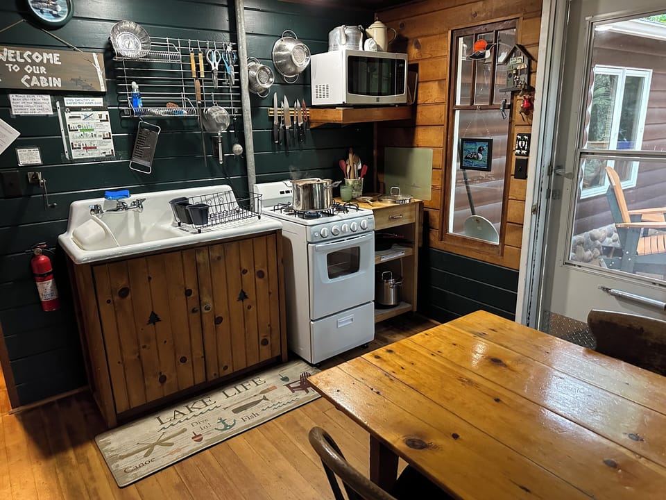 The kitchen is "cabin cozy" and has everything you need. Cook up a pot of soup!
