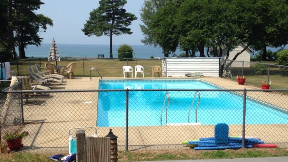 Fenced in pool off of the deck.
