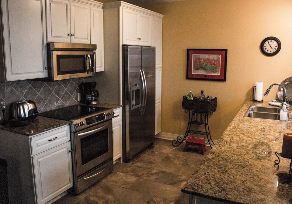 Beautiful, clean kitchen with stainless steel appliances. 