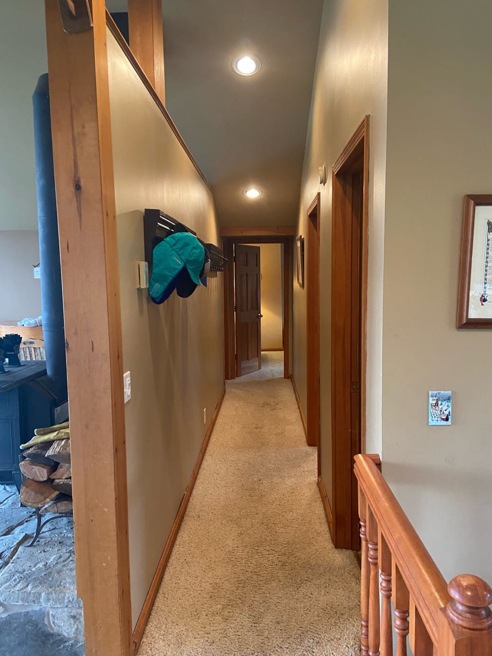 Main hallway leading to 3 main floor bedrooms and bathroom.