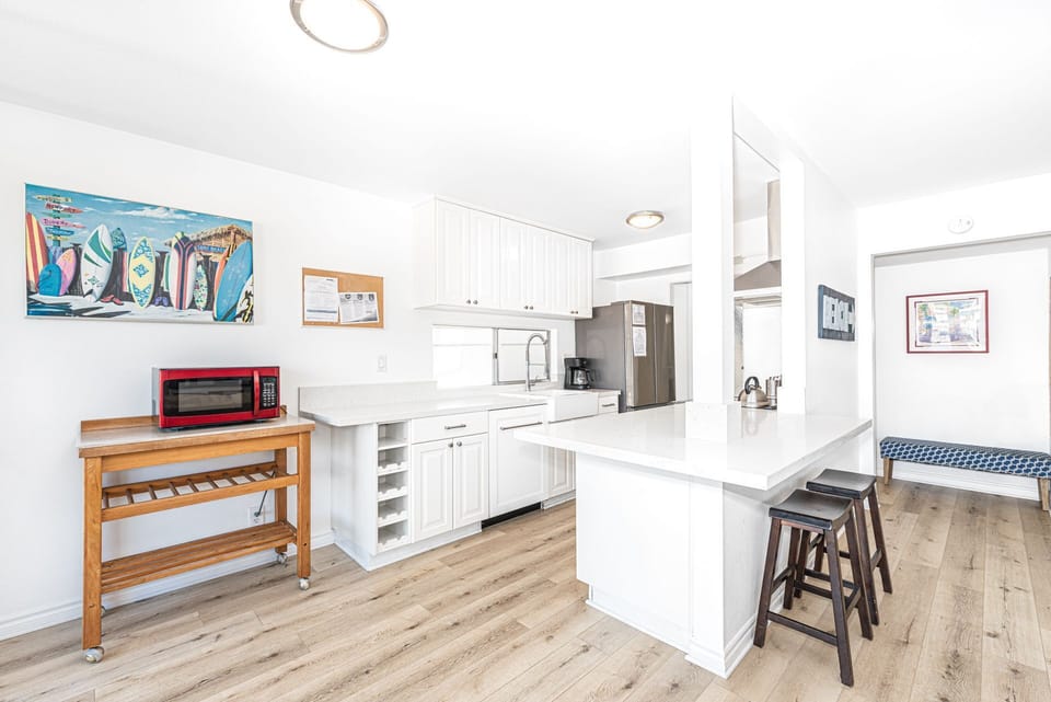 The kitchen opens out to the living area, making meal prep a social affair!
                