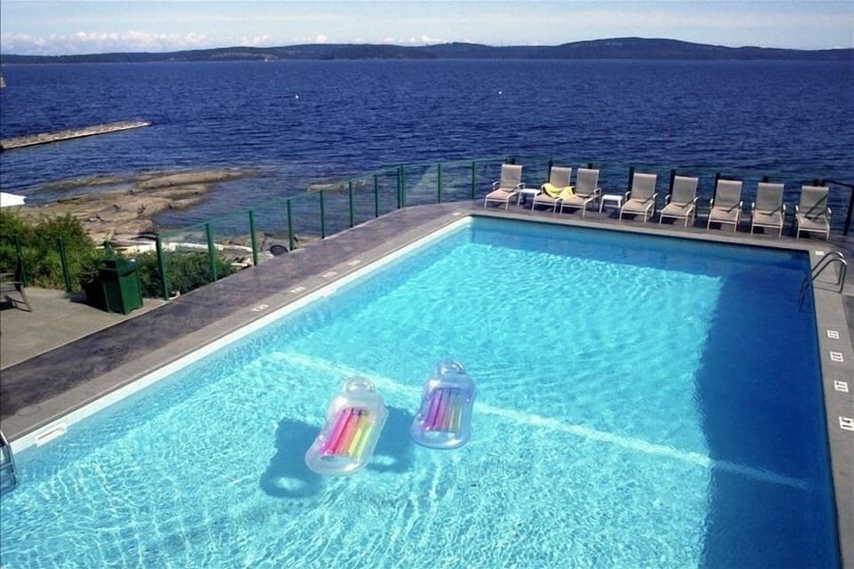 Beautiful heated pool, surrounded by water