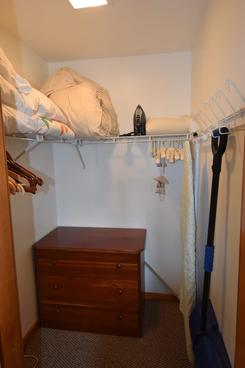 master bedroom walk in closet with chest of drawers