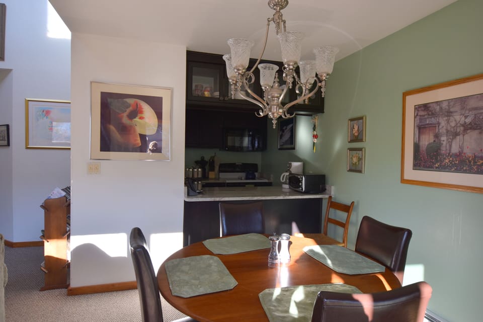 Dining room to kitchen open and airy feel plenty of light granite kitchen