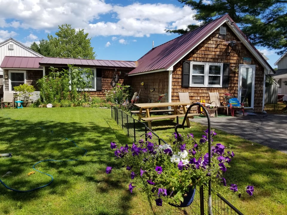 Peaceful shores from outside. Picnic table in small yard area
