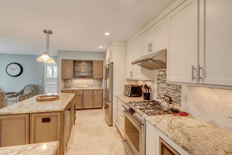 Gourmet kitchen with top of the line appliances including gas stove
