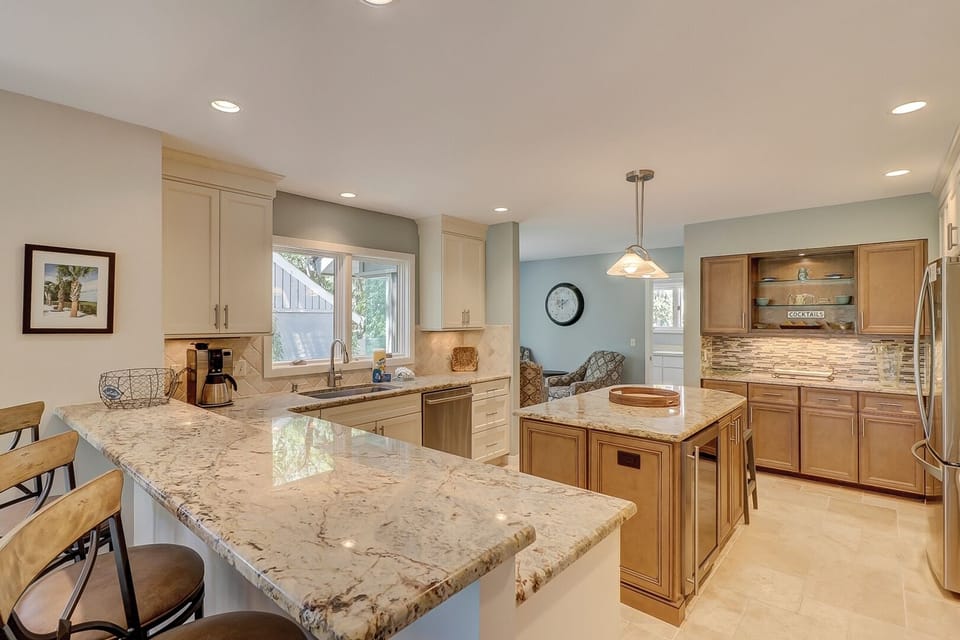 Bar area separates dining area and gourmet kitchen