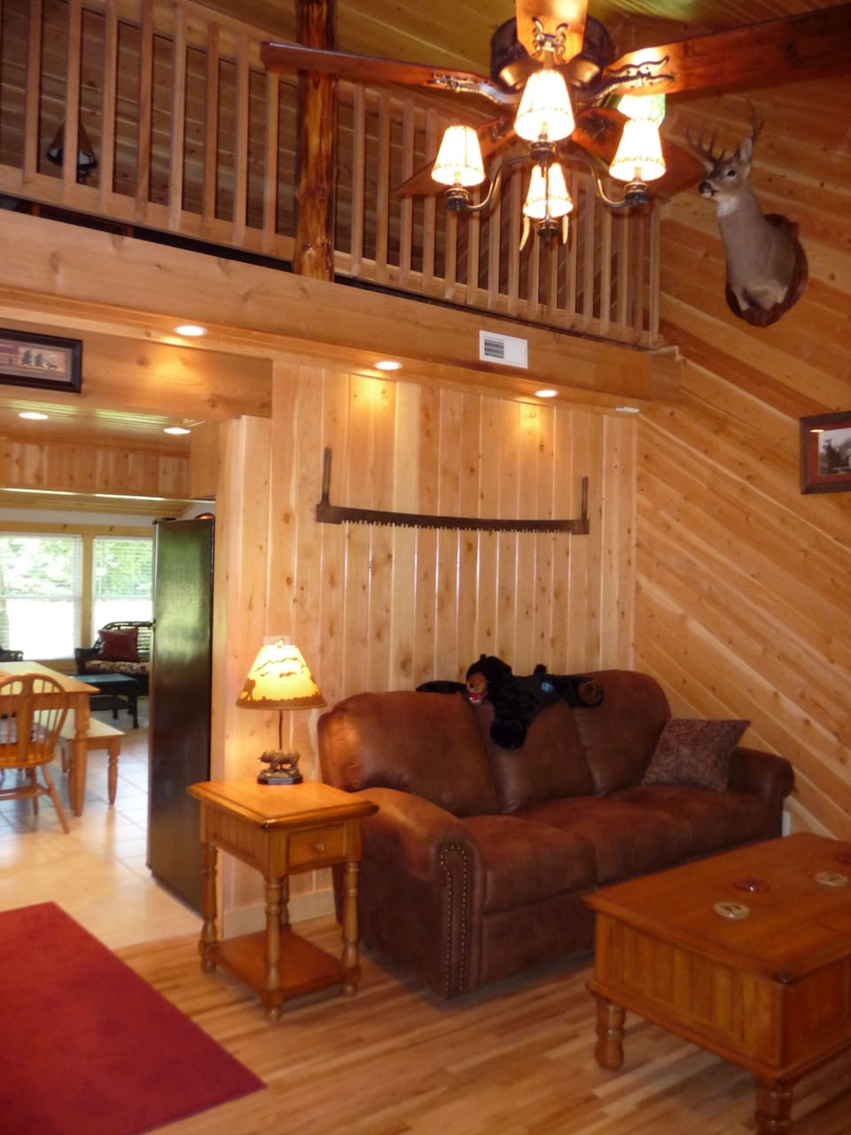 The living room of the cabin, with a view into the loft.