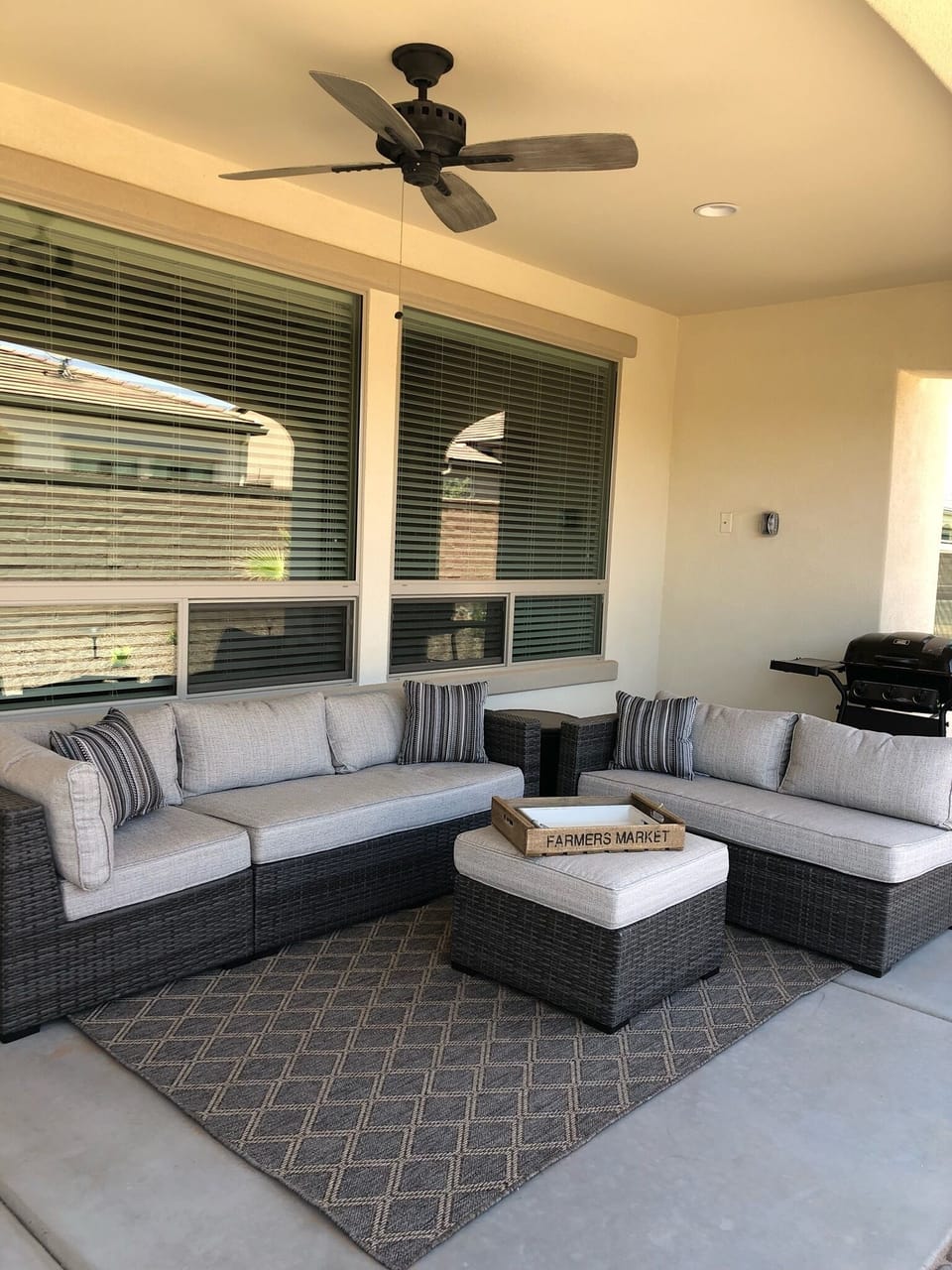 Elegant outdoor patio with beautiful outdoor fan and BBQ.  